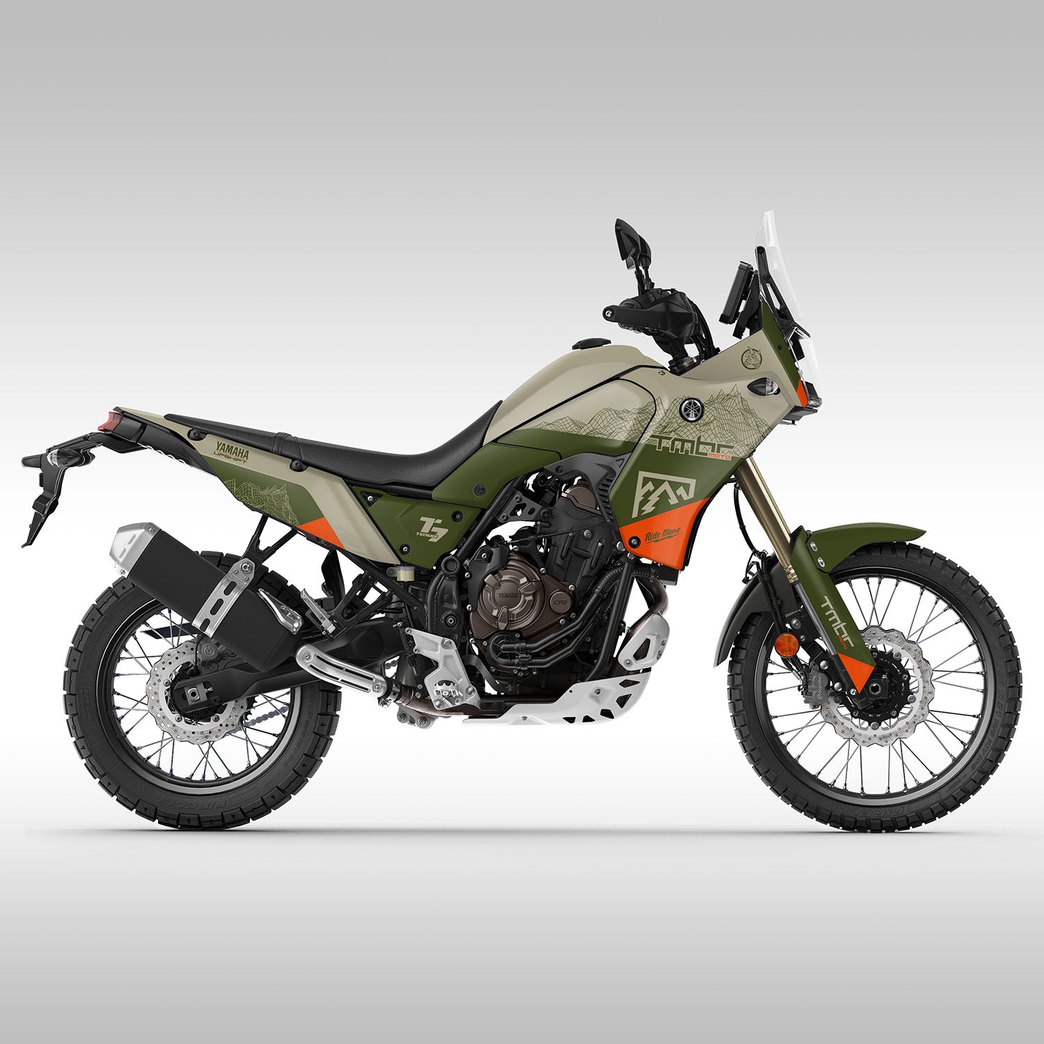 Side profile of the Tenere 700 with new TMBR MOTO graphics kit. Tan, alpine green and orange colors with a wire frame mountain design. Stock bodywork.