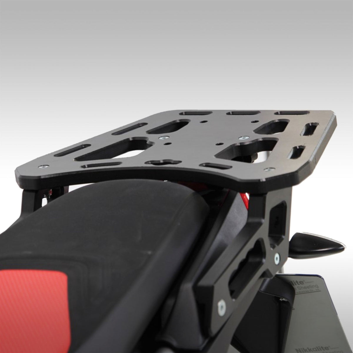 AXP Racing HDPE rear cargo rack installed on an Aprilia Tuareg 660.