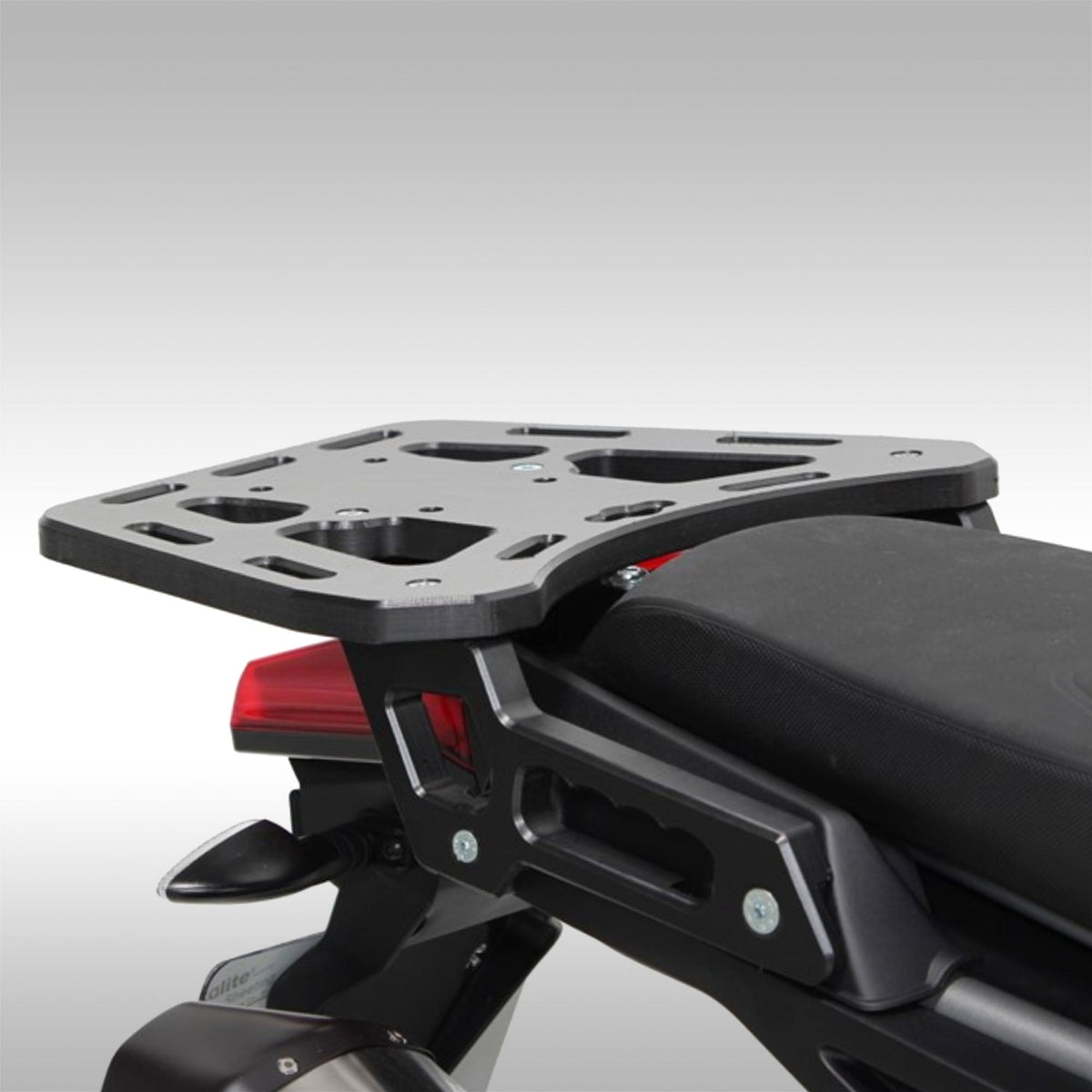 AXP Racing HDPE rear cargo rack installed on an Aprilia Tuareg 660.