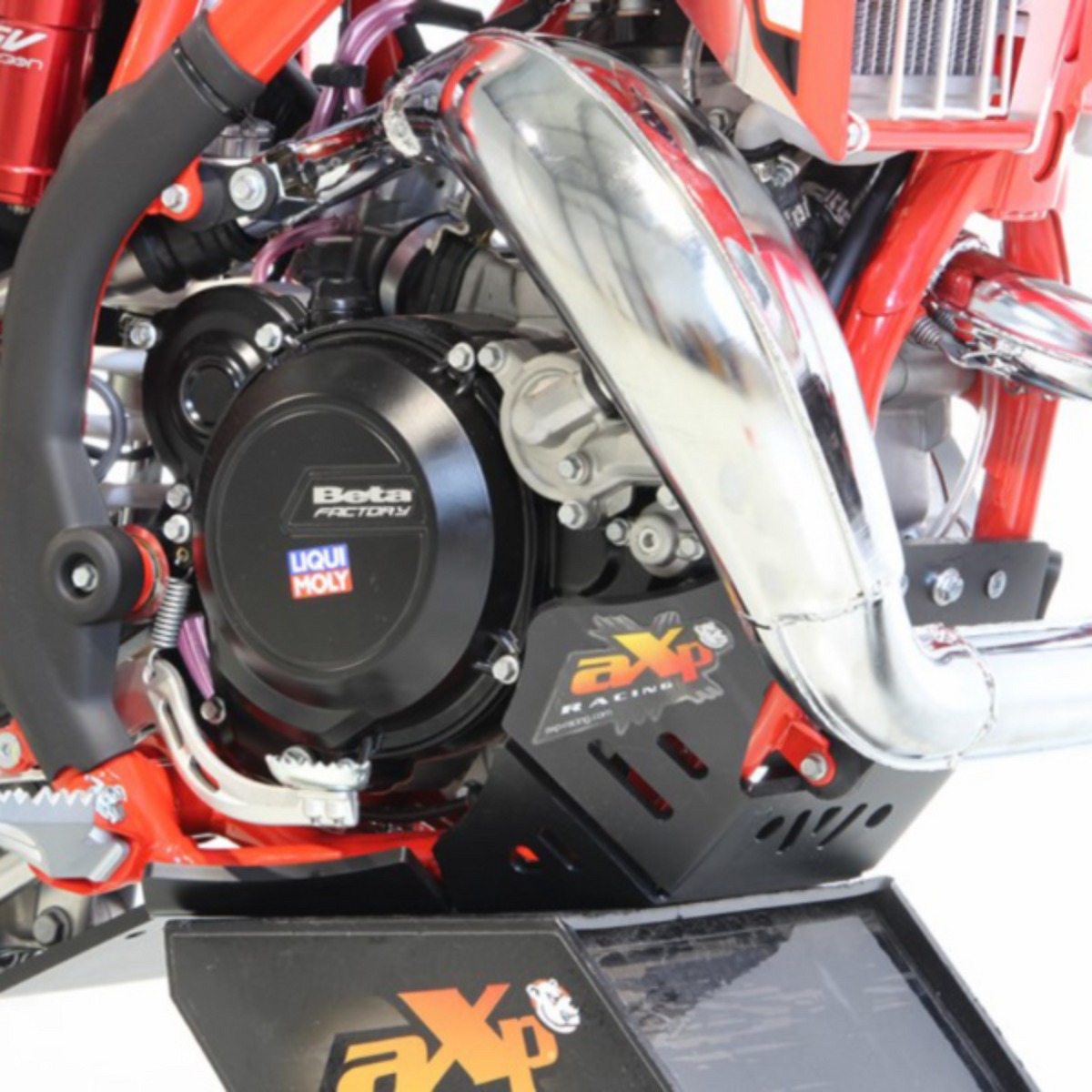 AXP Racing 8mm HDPE skid plate with integrated linkage guard installed on a Beta X-Trainer dirt bike.