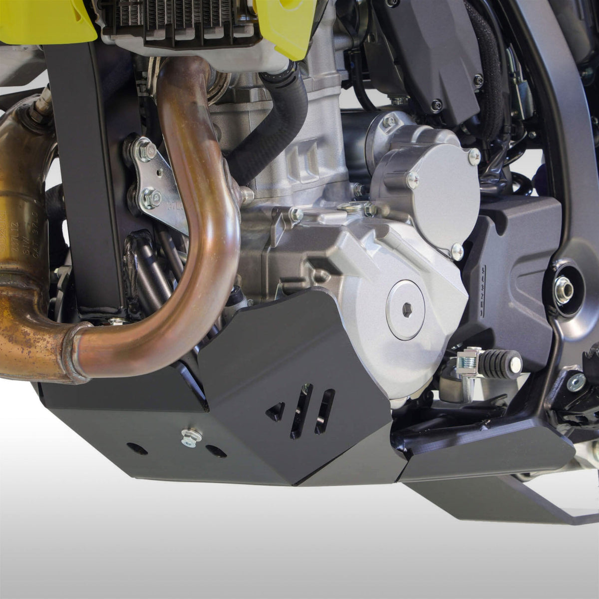 Black AXP Racing 8mm HDPE skid plate installed on a Suzuki DR-Z4S dual-sport motorcycle.