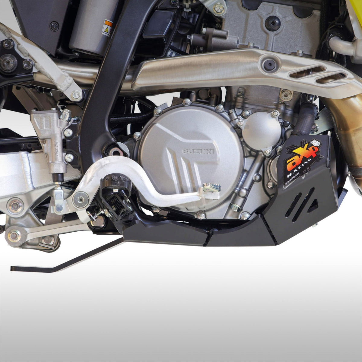 Black AXP Racing 8mm HDPE skid plate installed on a Suzuki DR-Z4S dual-sport motorcycle.