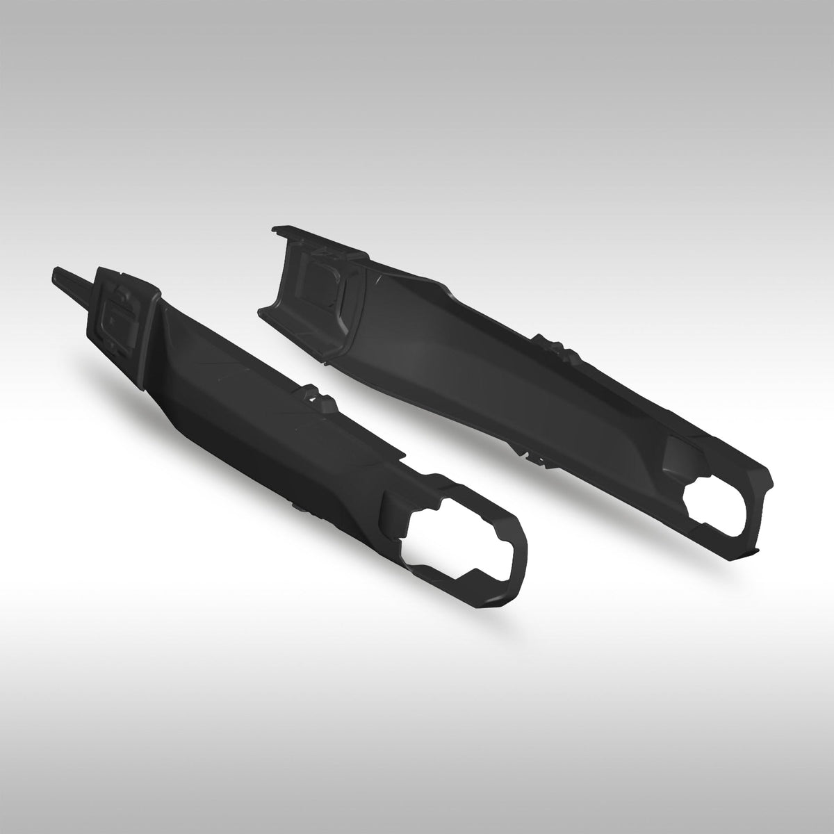 Two black Yamaha Ténéré 700 swing arm guards on a gray background