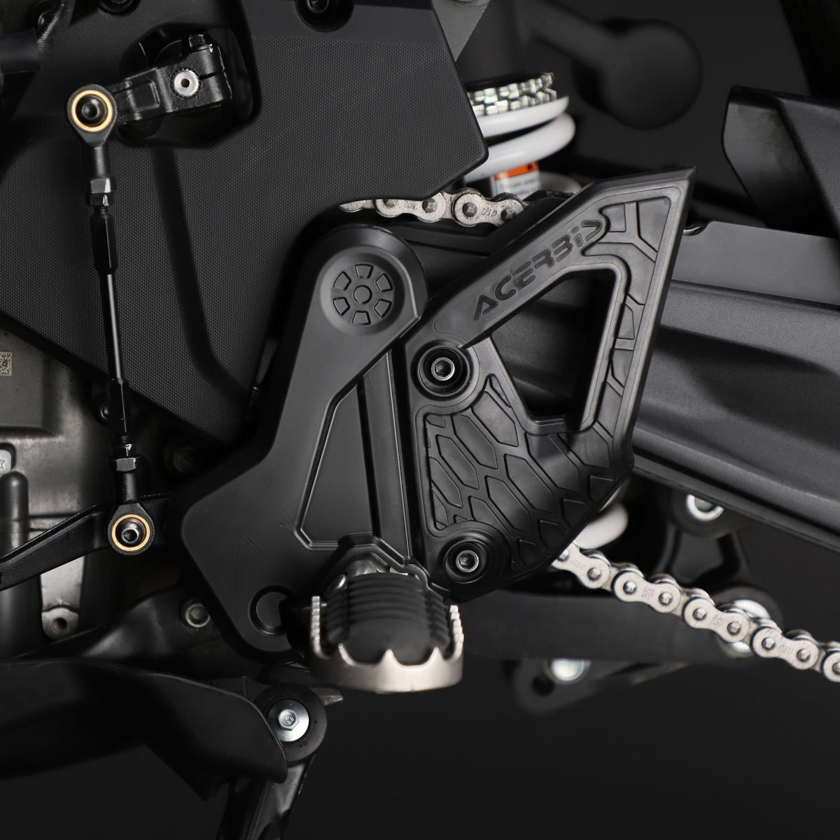 Black Acerbis X-Grip frame guards showing rubberized grip panels installed on a CFMOTO Ibex 450 adventure motorcycle.