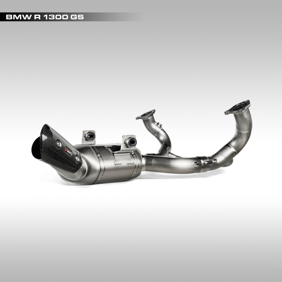 Akrapovic titanium header for BMW R1300GS on a light gray background