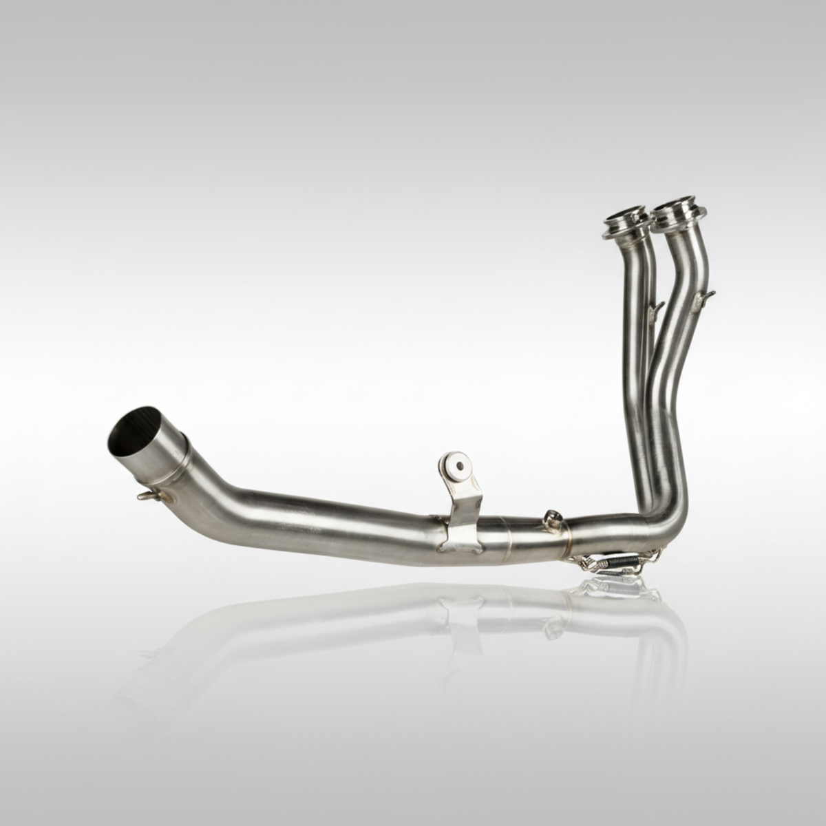 Stainless steel header pipe from Akrapovic for the Honda XL750 Transalp on a light gray background.