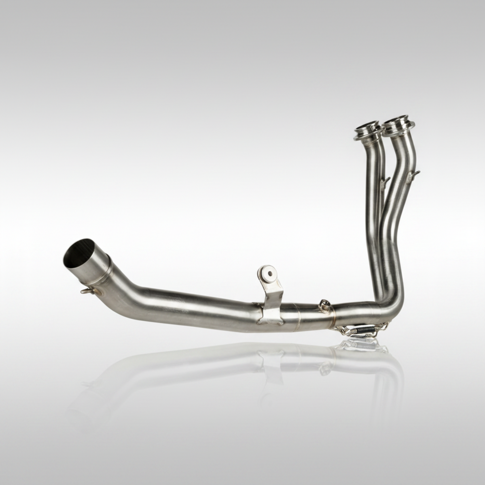 Stainless steel header pipe from Akrapovic for the Honda XL750 Transalp on a light gray background.