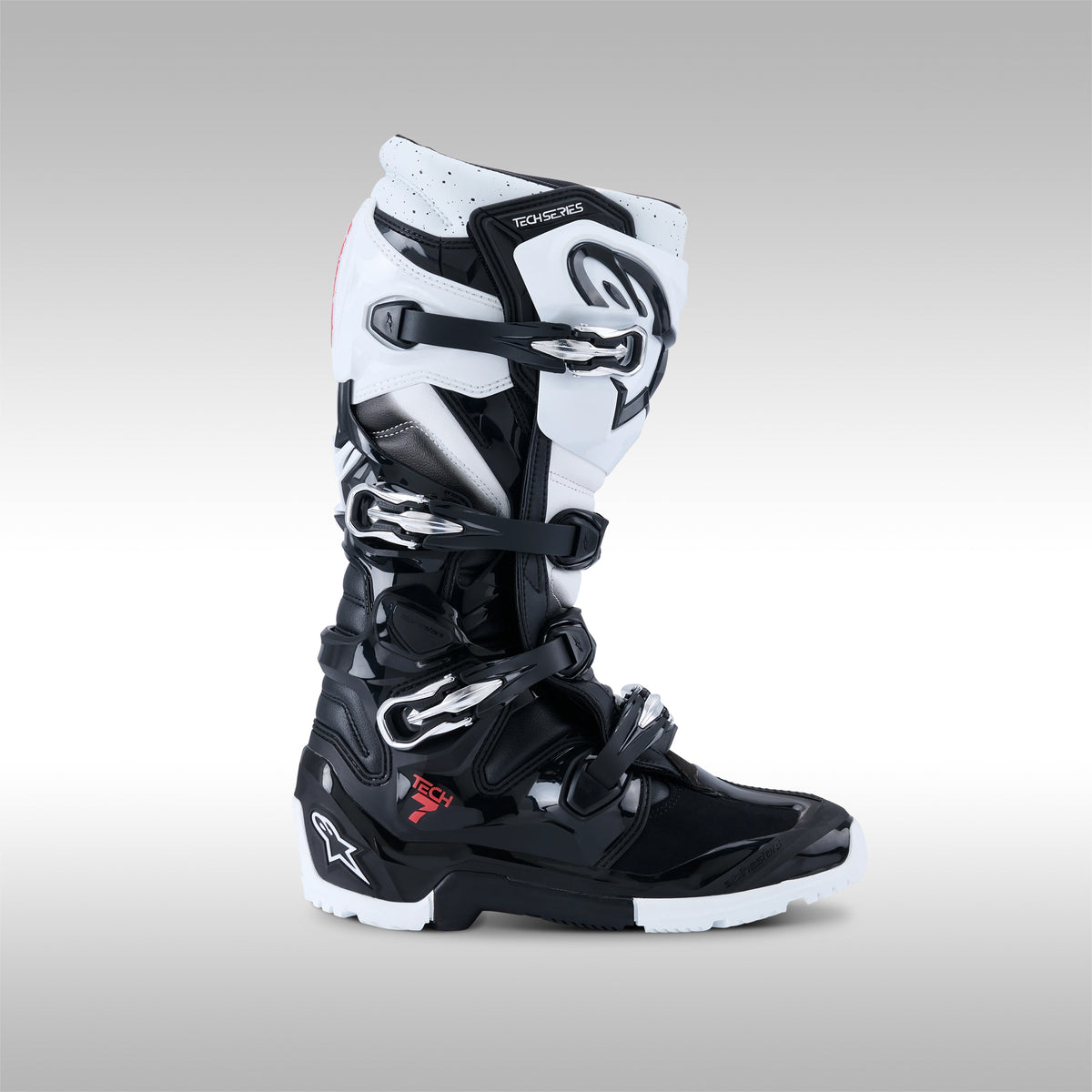 Single black and white Alpinestars Tech 7 Enduro offroad boots on a gray background at TMBR MOTO