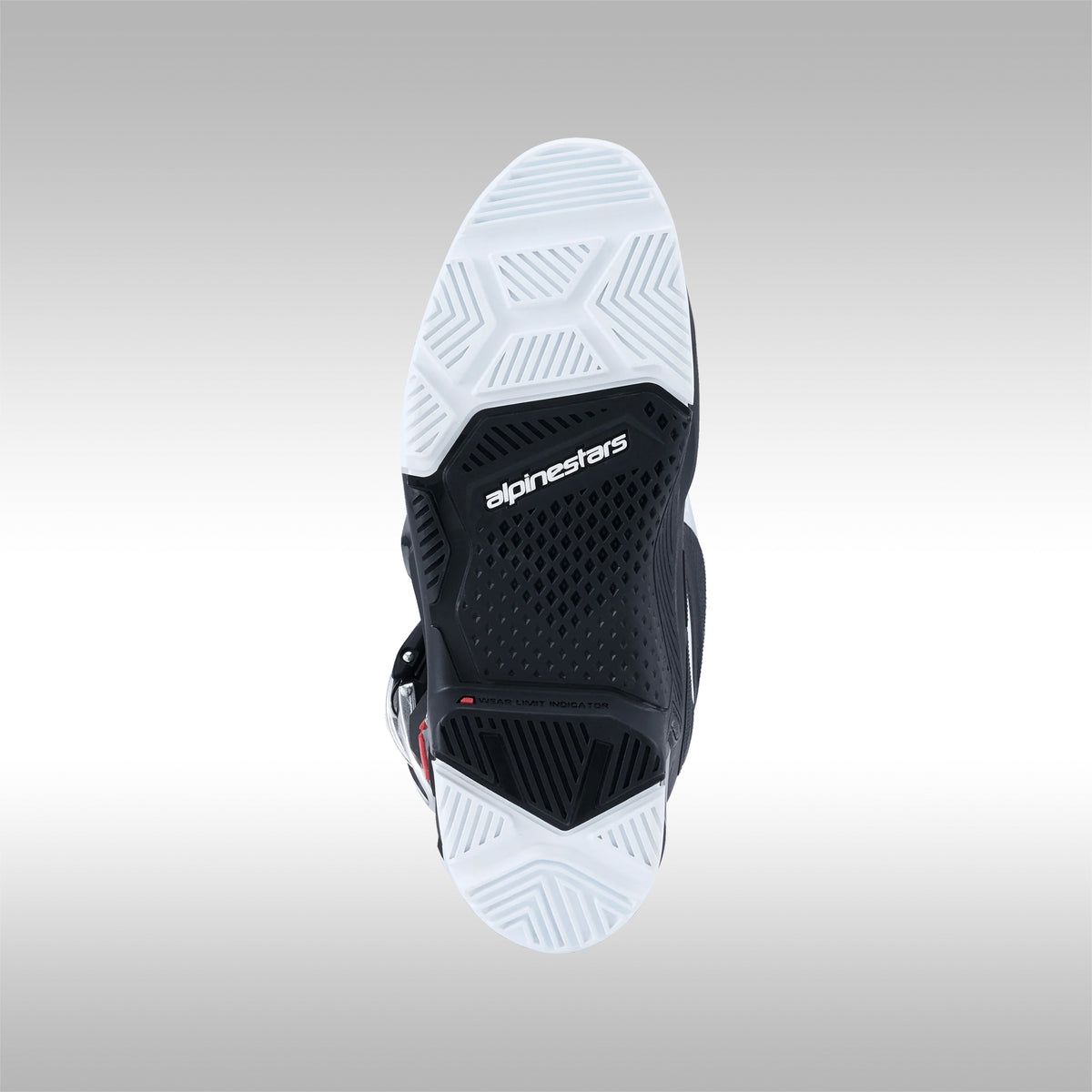 Single black and white Alpinestars Tech 7 Enduro offroad boot sole on a gray background at TMBR MOTO