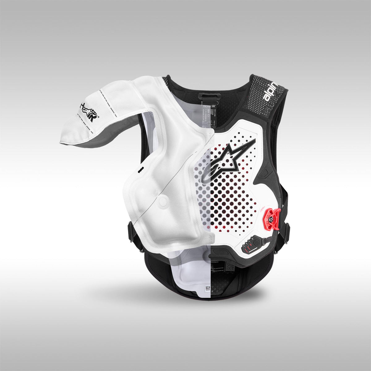 Black and white Alpinestars protective vest with red accents on a gray background