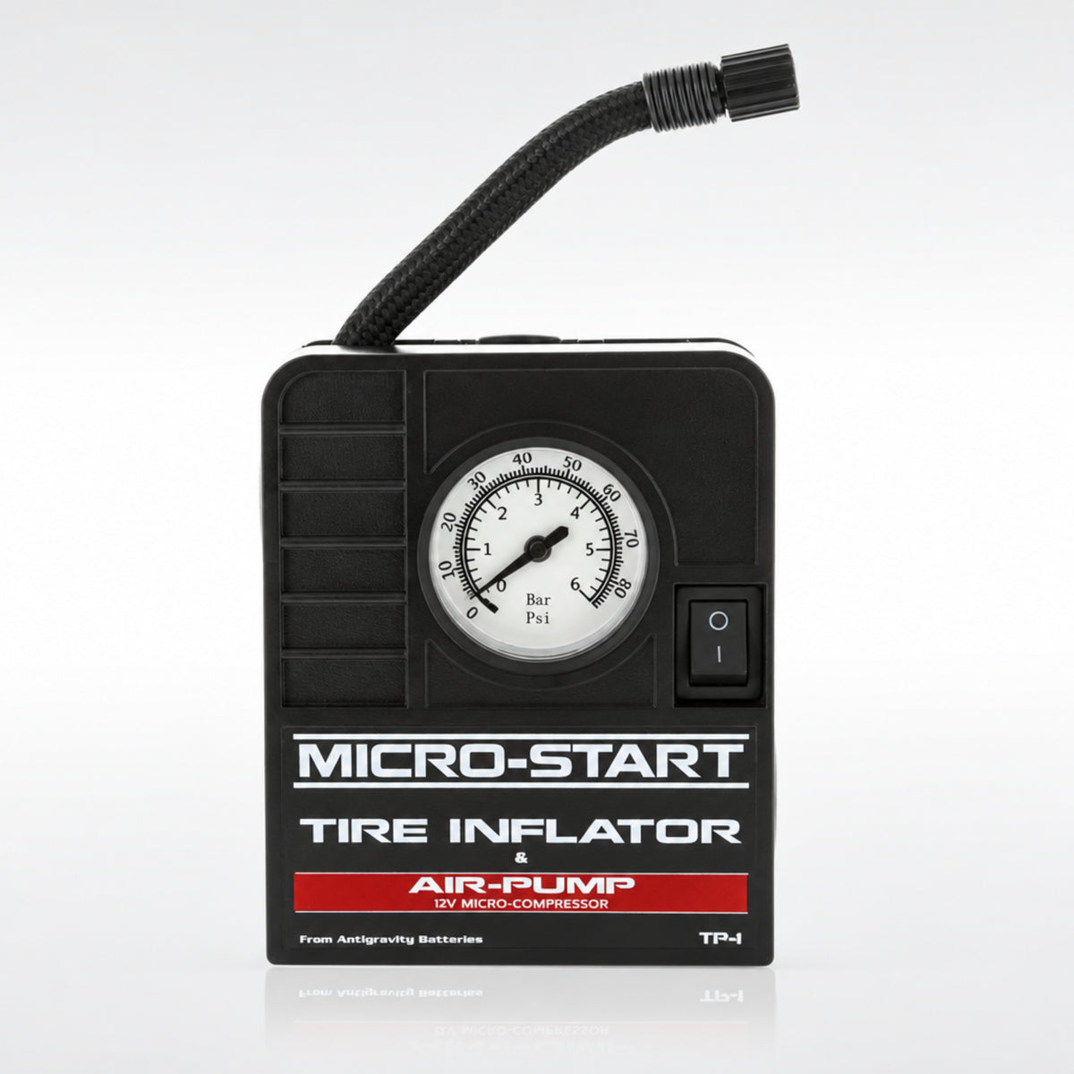 Antigravity AG-MSA-9 Micro-Start portable tire inflator showing the built in pressure gauge and compact black housing.