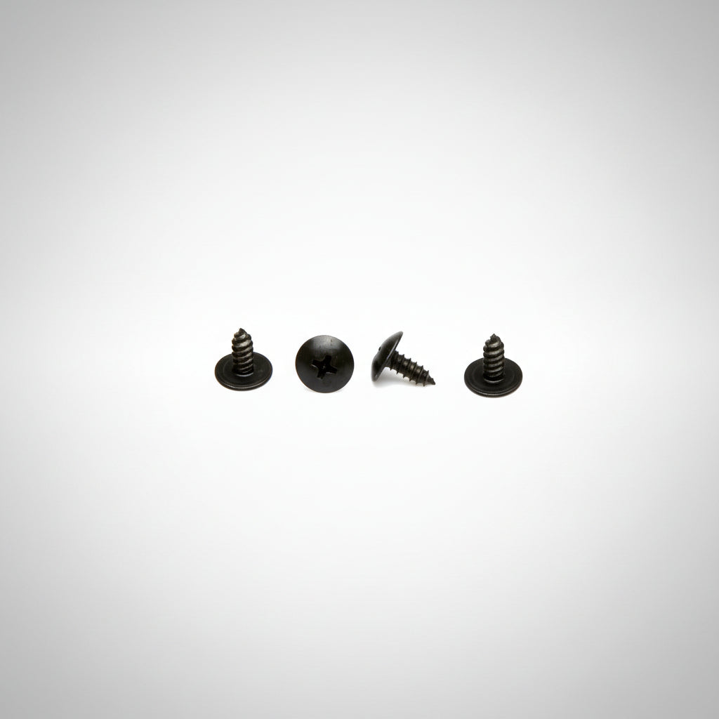 Four black Barkbusters guard screws on a gray background