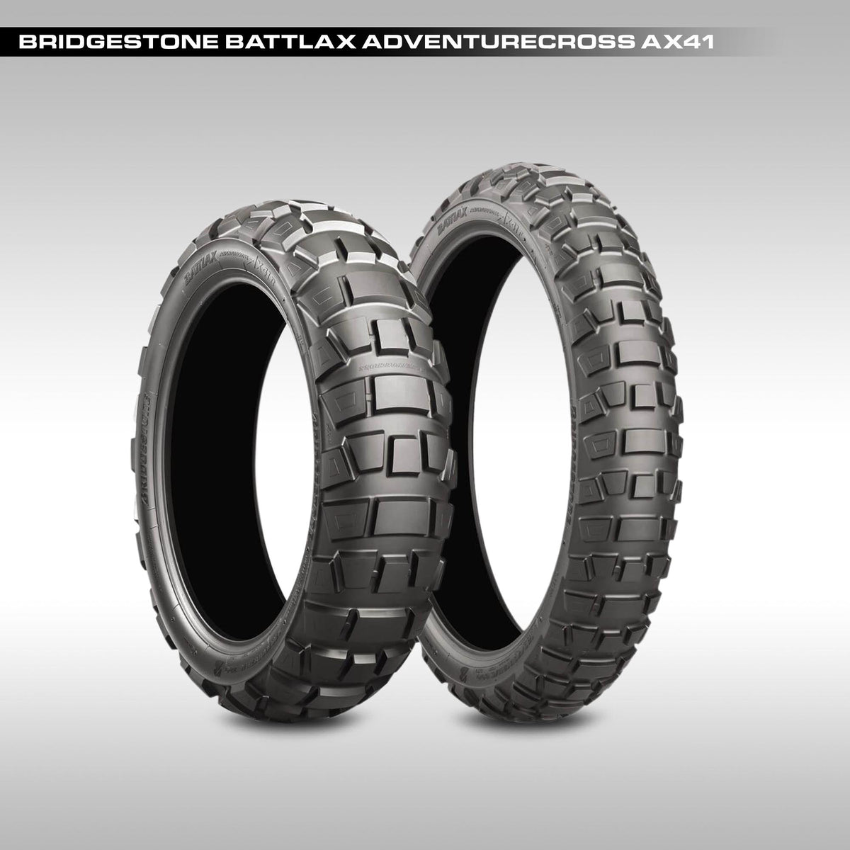 Two Bridgestone Battlax Adventurecross AX41 tires on a gray background
