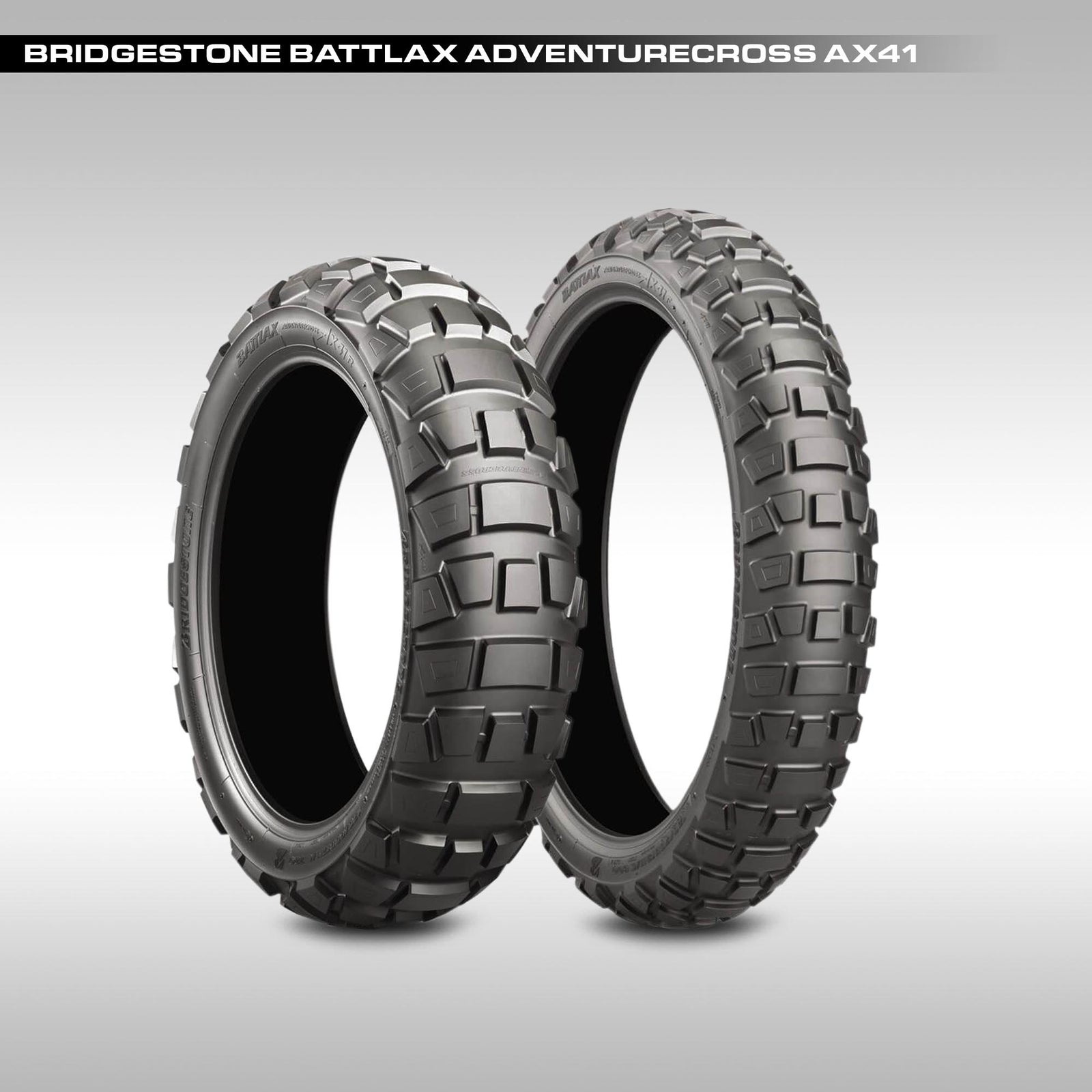 Two Bridgestone Battlax Adventurecross AX41 tires on a gray background