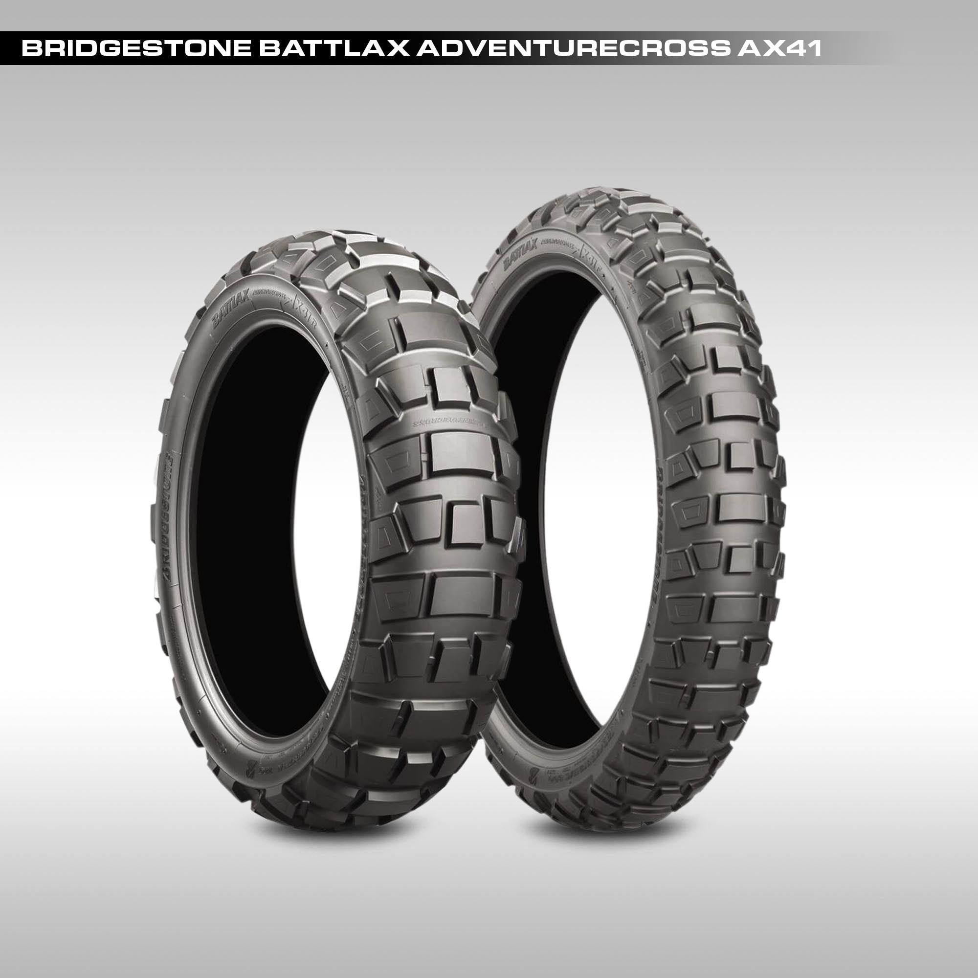 Two Bridgestone Battlax Adventurecross AX41 tires on a gray background