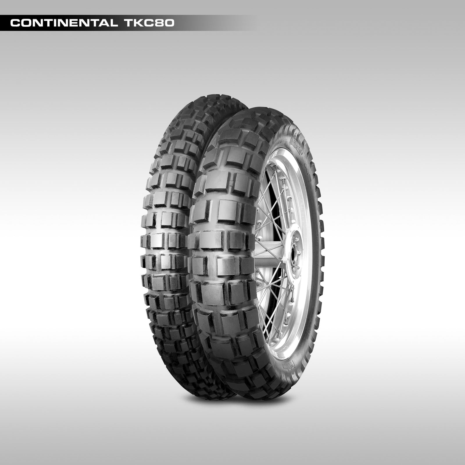 Continental TKC80 motorcycle tire studio image of the front and rear tires. Image is labeled.
