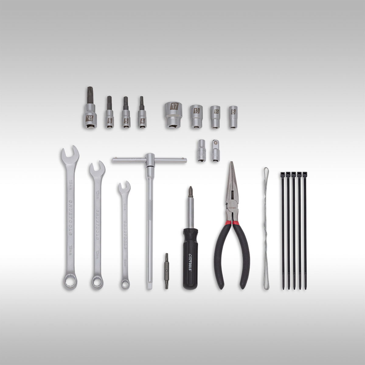 Various CruzTools dirtbike tools on a light gray background