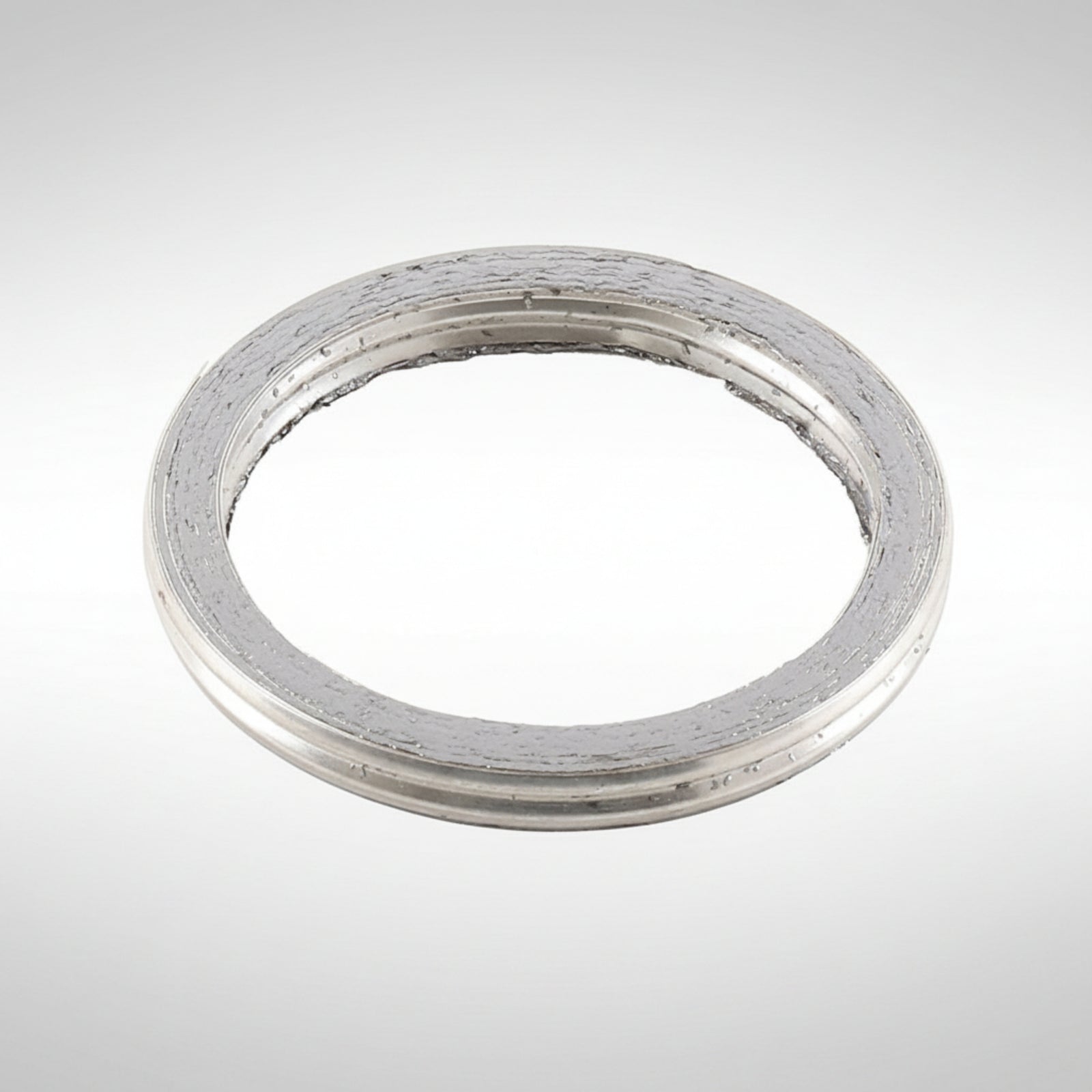 High-temperature copper exhaust crush gasket for motorcycle header pipes.