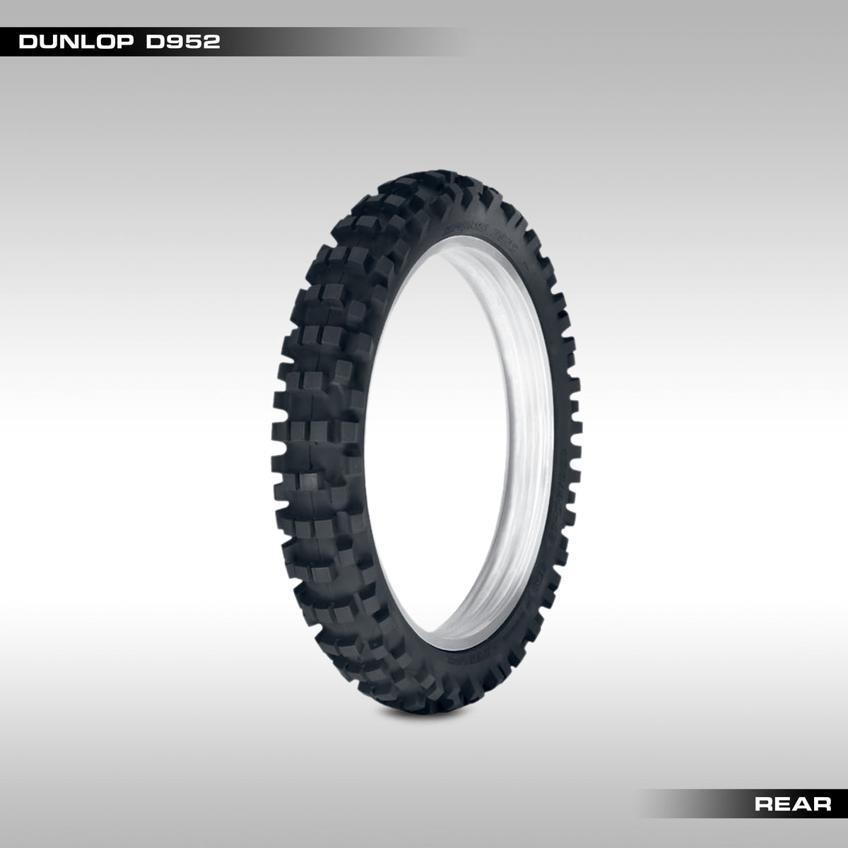 Rear Dunlop D952 off-road motorcycle tire with knoby pattern tread on a white background.