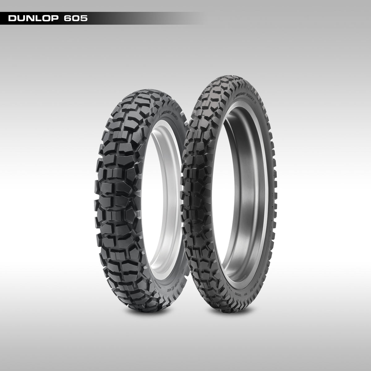 Front and rear Dunlop D605 tires with tread pattern visible on a gray background