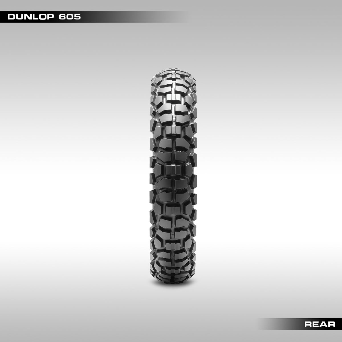 Rear Dunlop D605 tire with tread pattern visible on a gray background