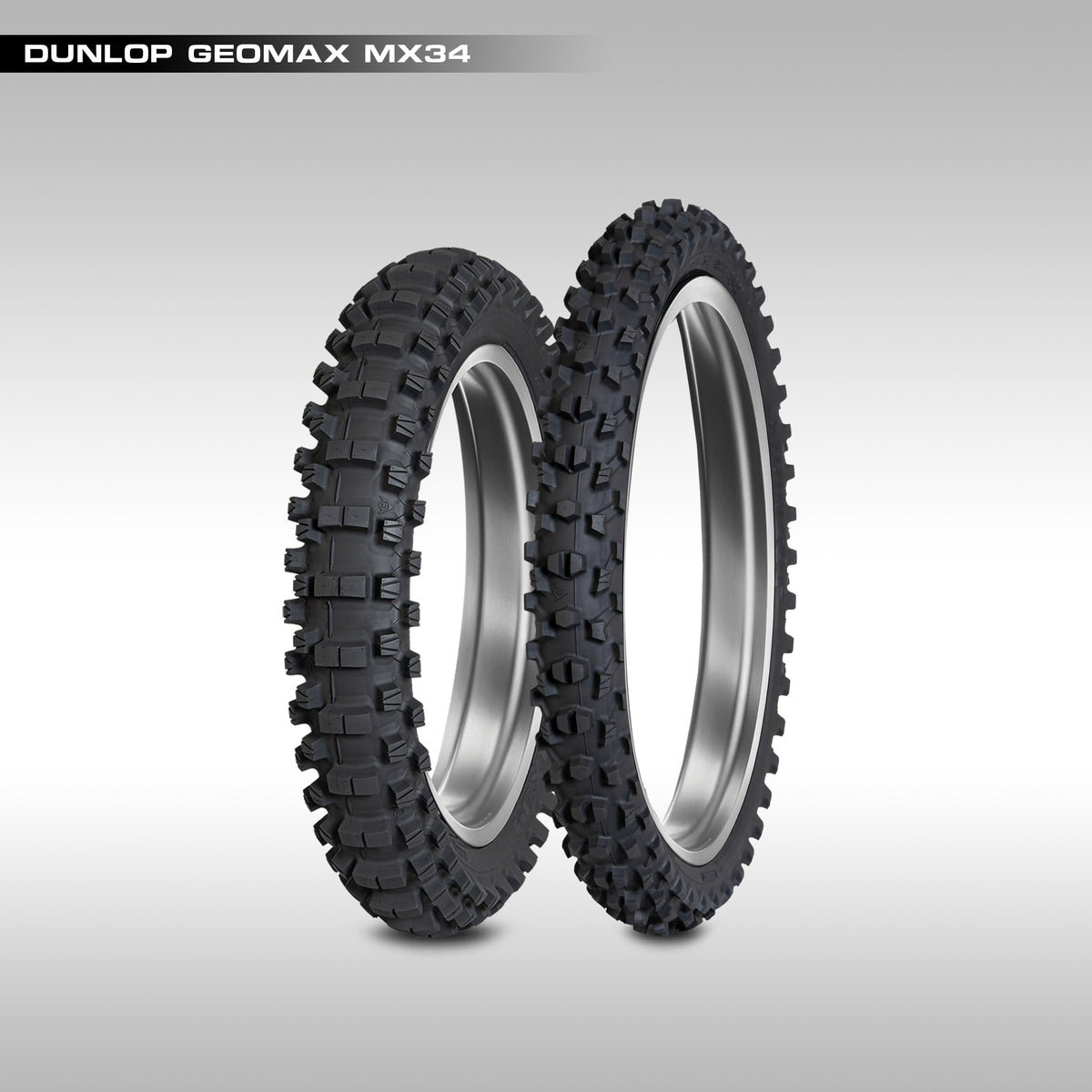 Two Dunlop Geomax MX34 tires on a gray background