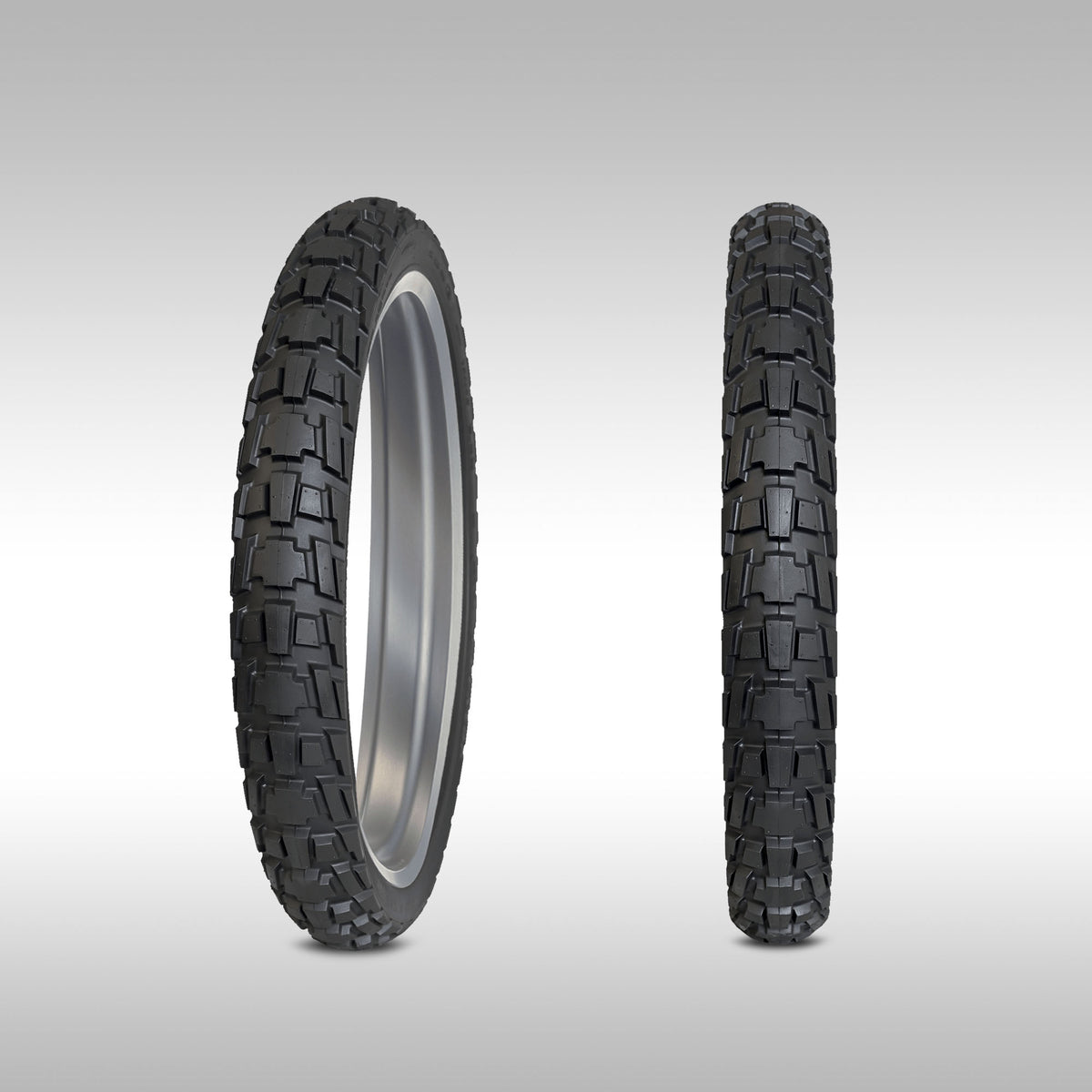 Two Dunlop Trailmax Raid motorcycle tires, two fronts at different angles, displayed against a grey background.