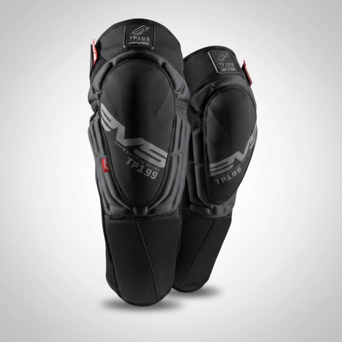 Black knee pads with branding on a light gray background