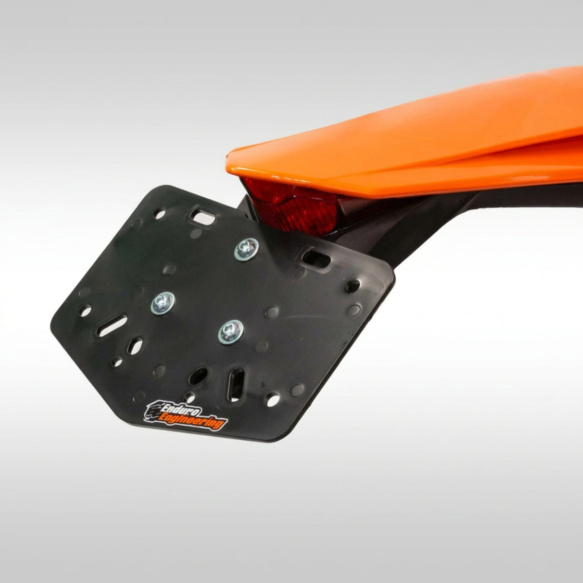 Enduro Engineering 22-700 black universal plastic dirt bike license plate backer holder with mounting hardware kit.