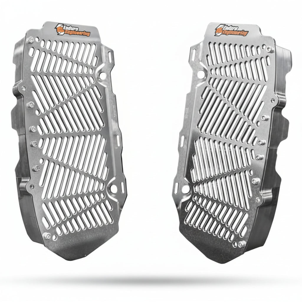 Pair of aluminum radiator guards with brand logo on a white background