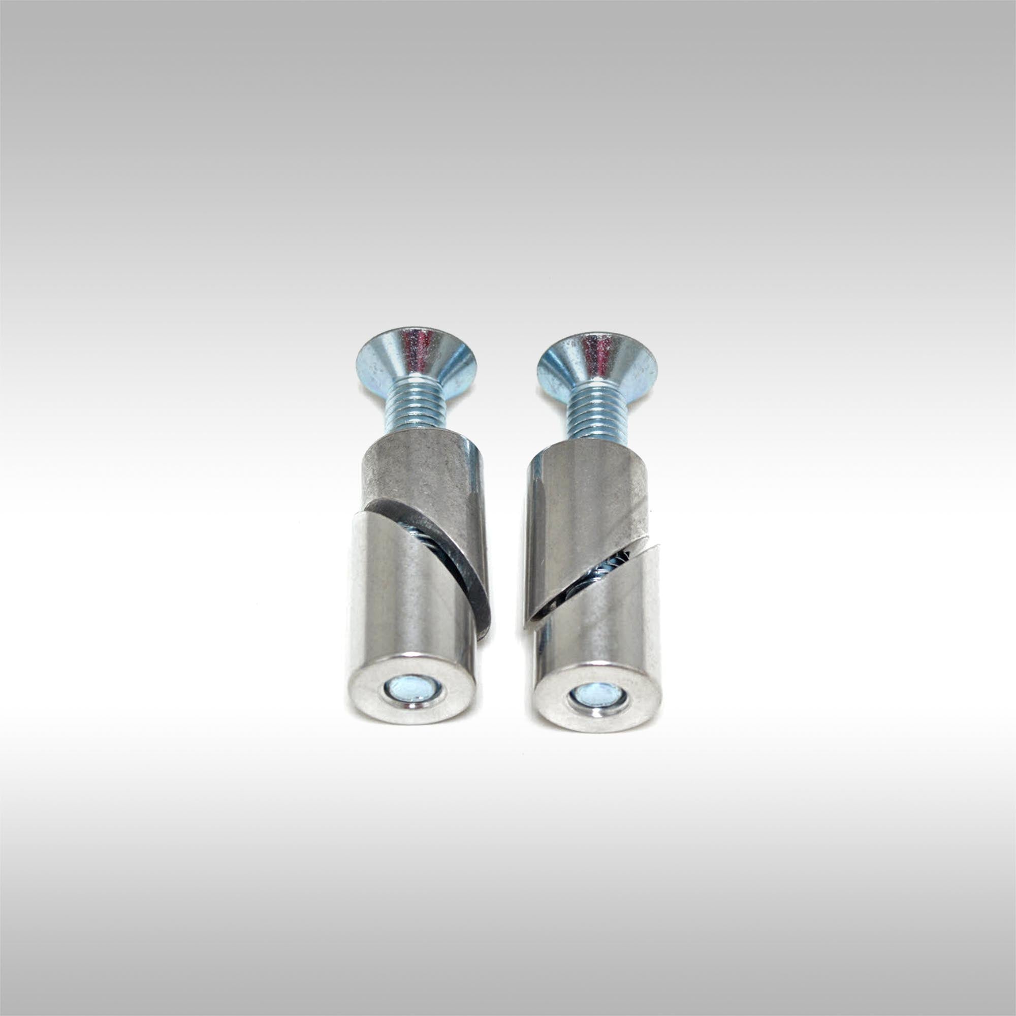 Two aluminum taper locks with threaded ends and bolts on a light gray background