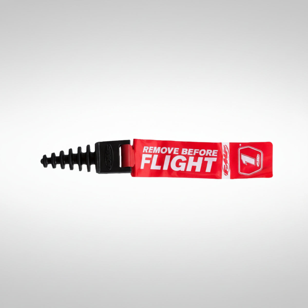 FMF Racing 012875 red rubber 2-stroke exhaust wash plug with attached warning streamer.