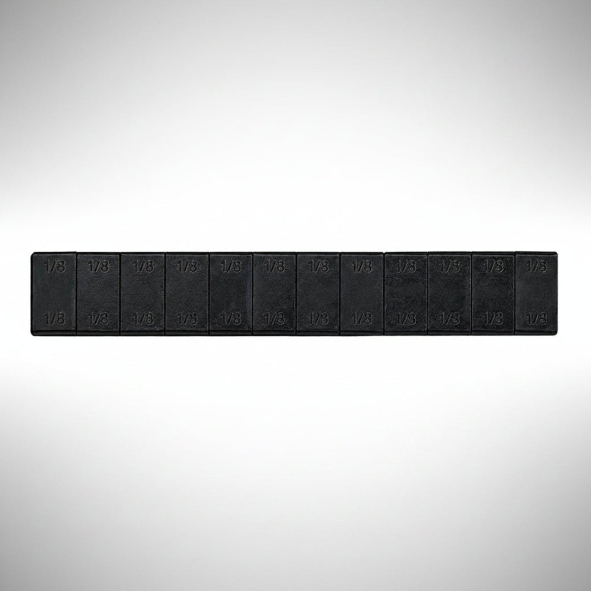 Fire Power adhesive stick-on wheel weight strips on a backing sheet.