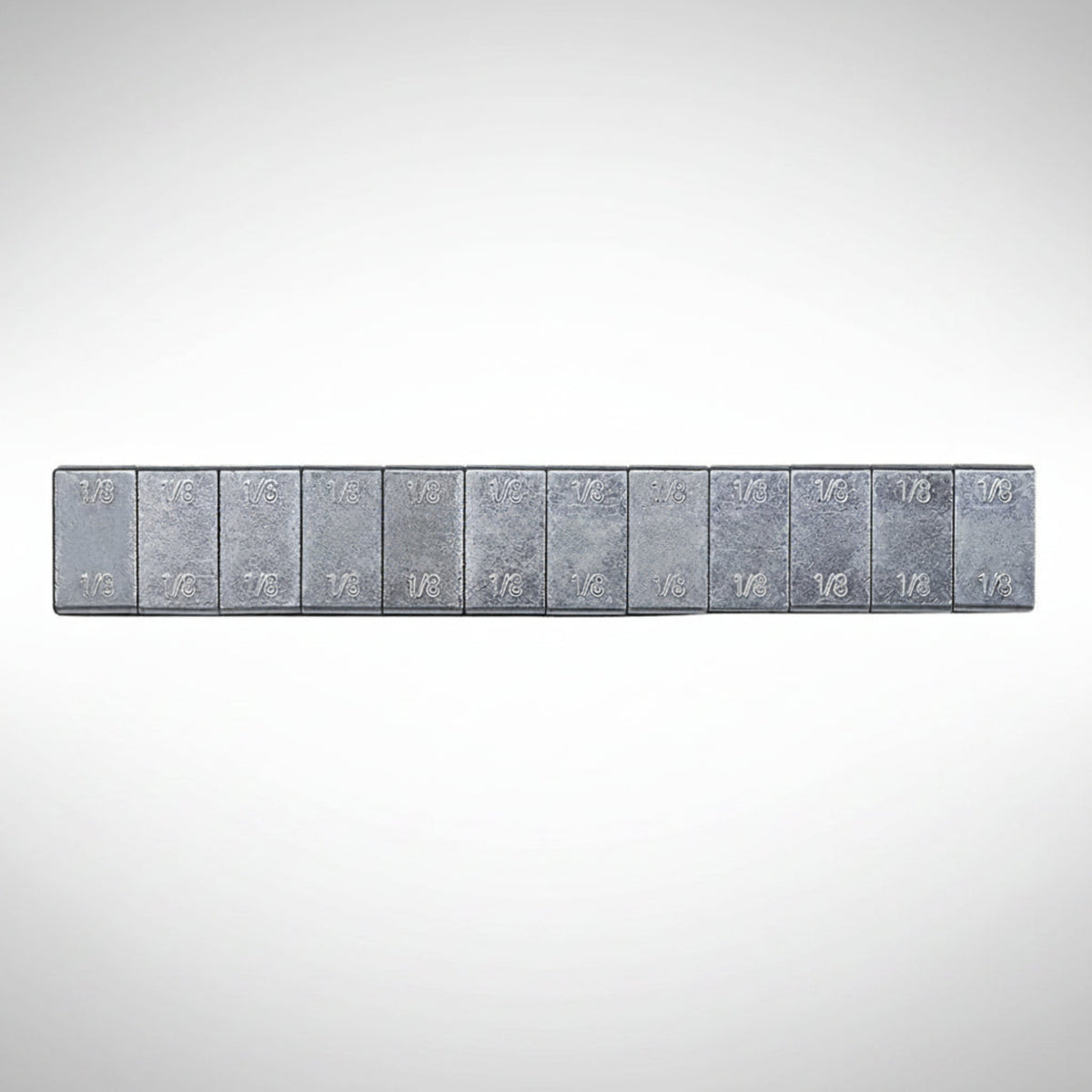 Fire Power adhesive stick-on wheel weight strips on a backing sheet.