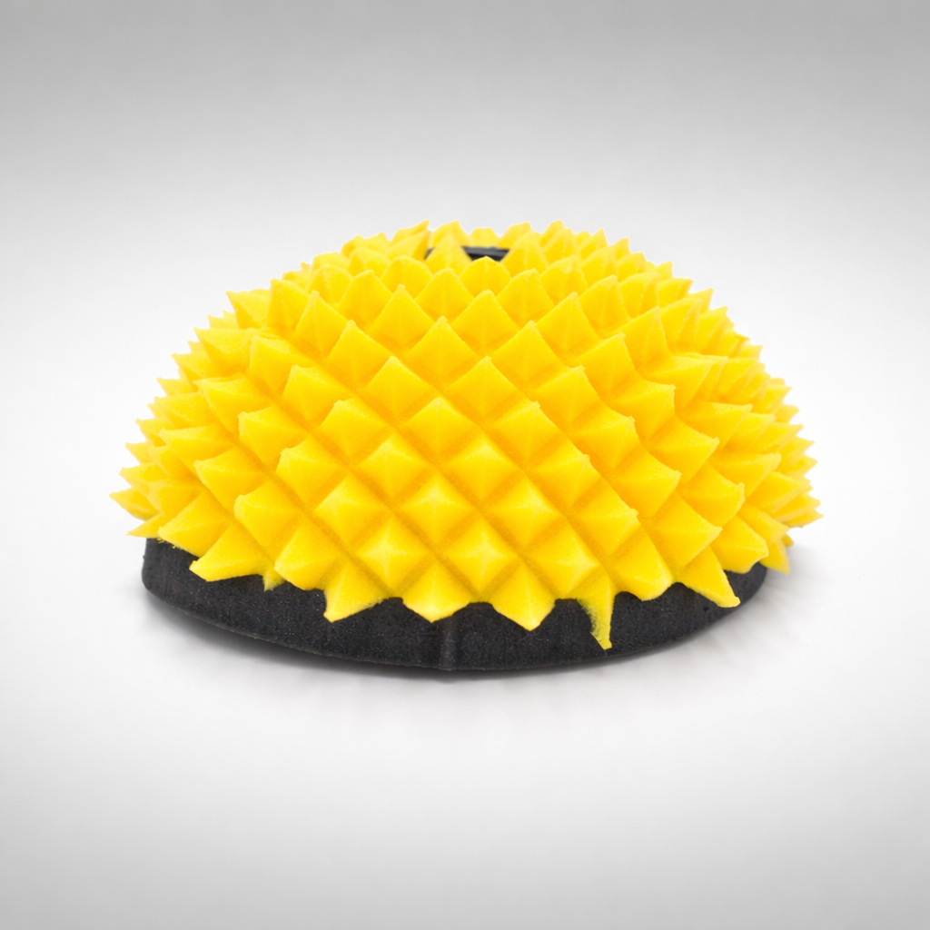 Yellow and black FunnelWeb foam air filter on a gray background