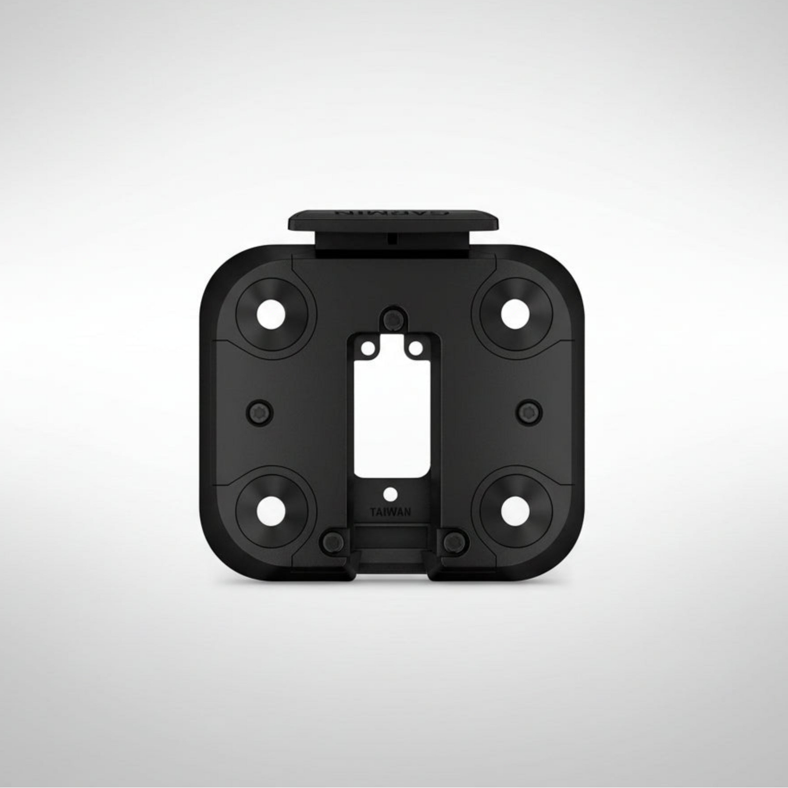 Black plastic Garmin XT3 mount plate on a light gray background