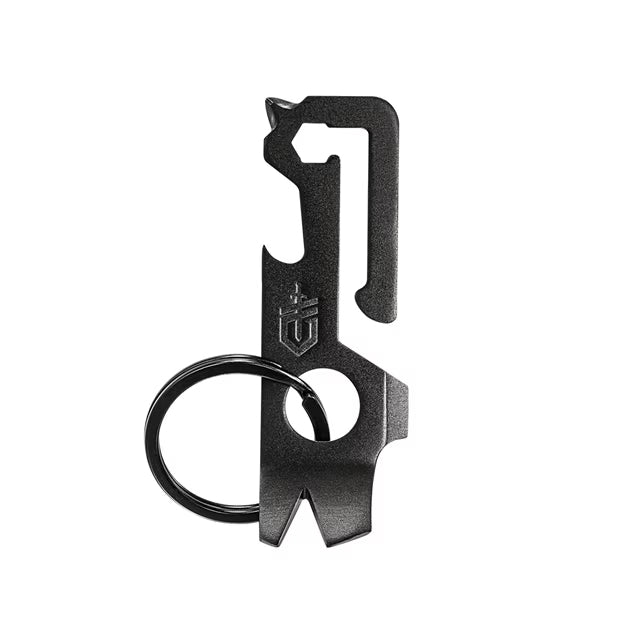 A black Gerber Mullet keychain tool with multiple implements, including a bottle opener and drivers, displayed against a grey background.