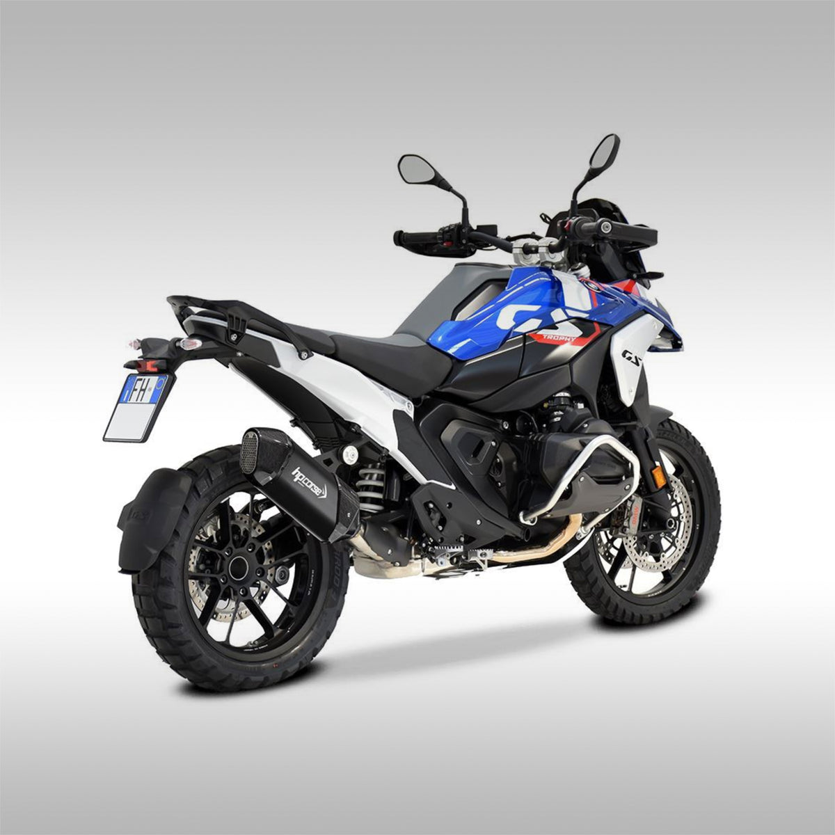 Black titanium and carbon fiber slip-on exhaust for the BMW R 1300 GS motorcycle. Rear 3/4 view of Trophy Edition with the exhaust installed.