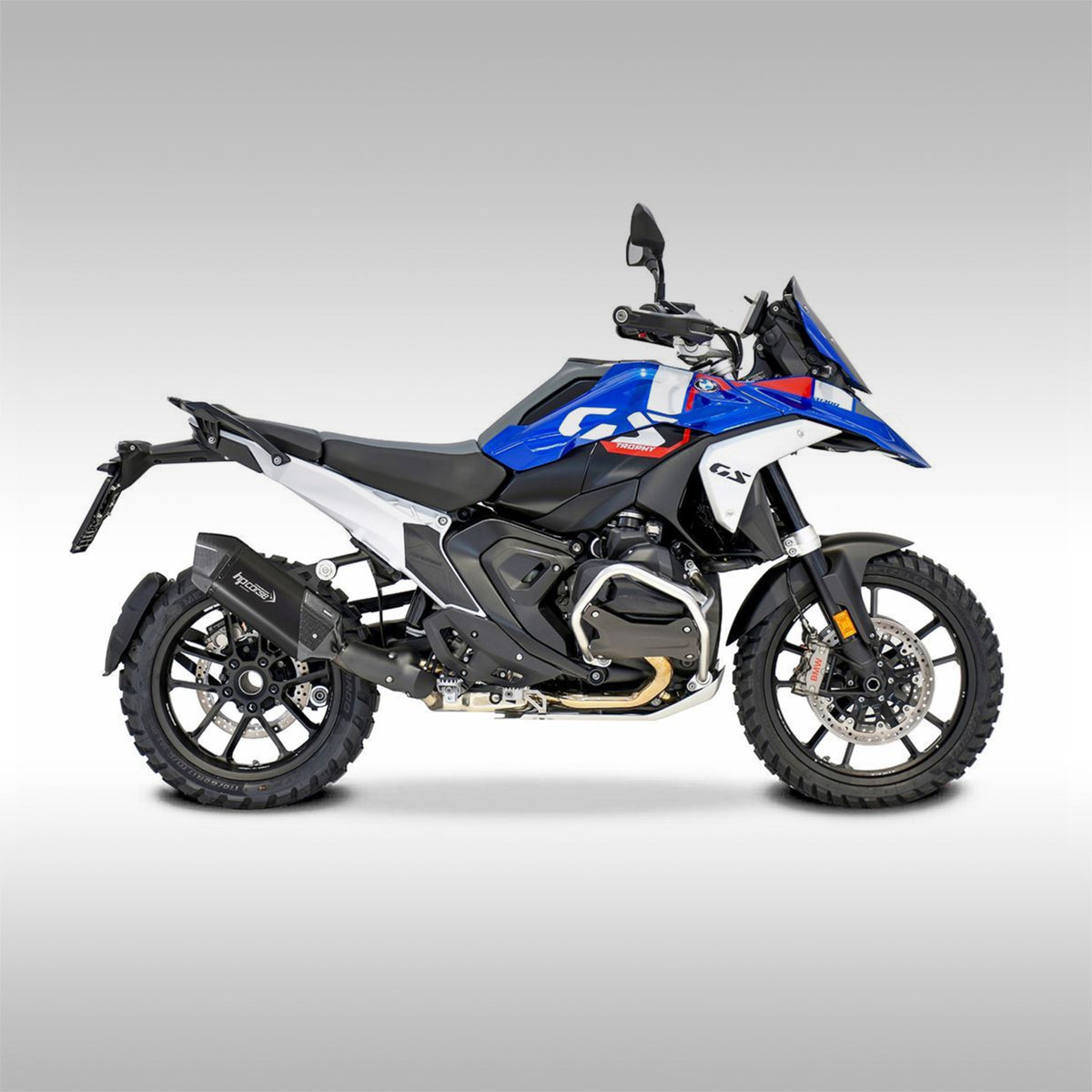 Black titanium and carbon fiber slip-on exhaust for the BMW R 1300 GS motorcycle. Side profile of Trophy Edition with the exhaust installed.
