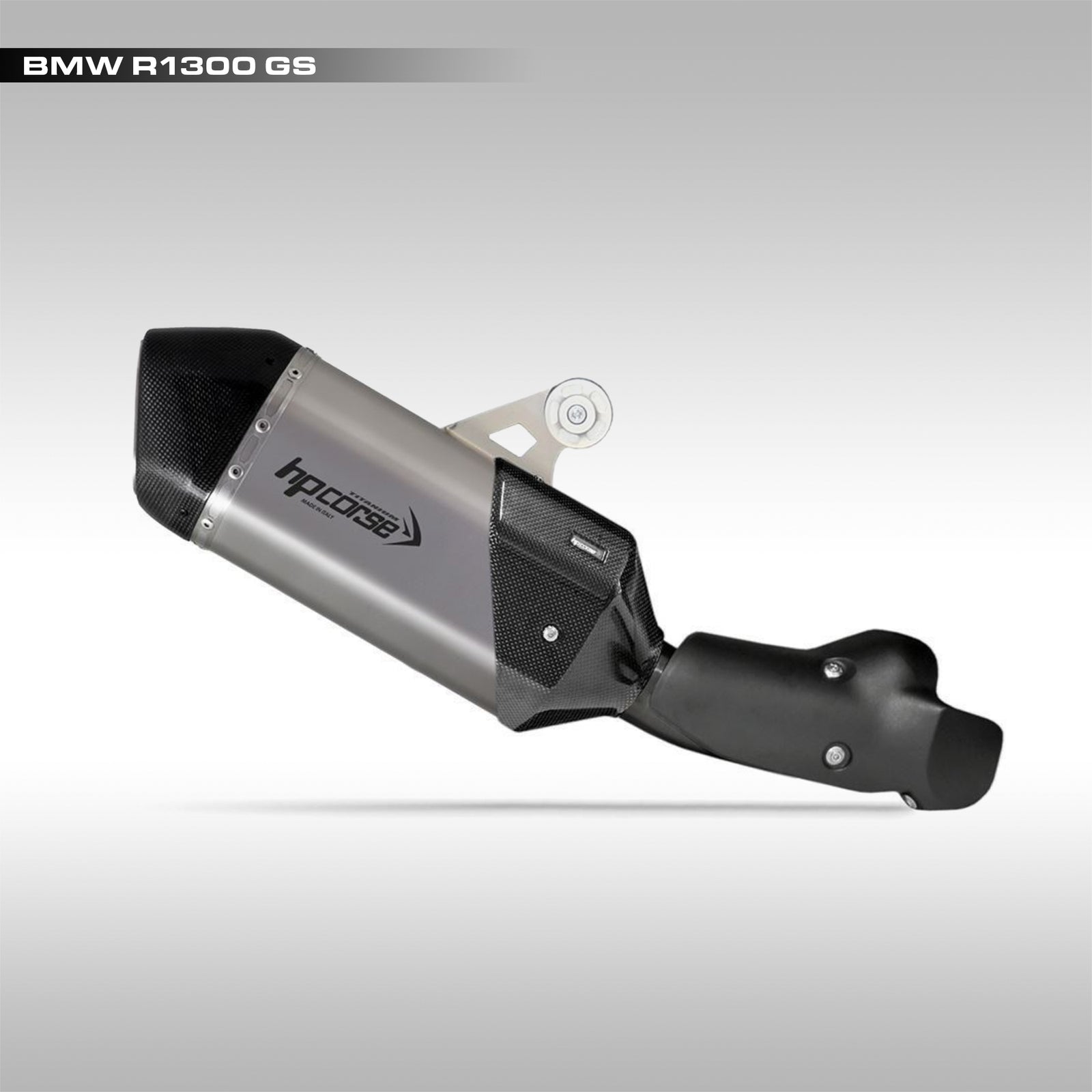 Raw titanium and carbon fiber slip-on exhaust for the BMW R 1300 GS motorcycle.