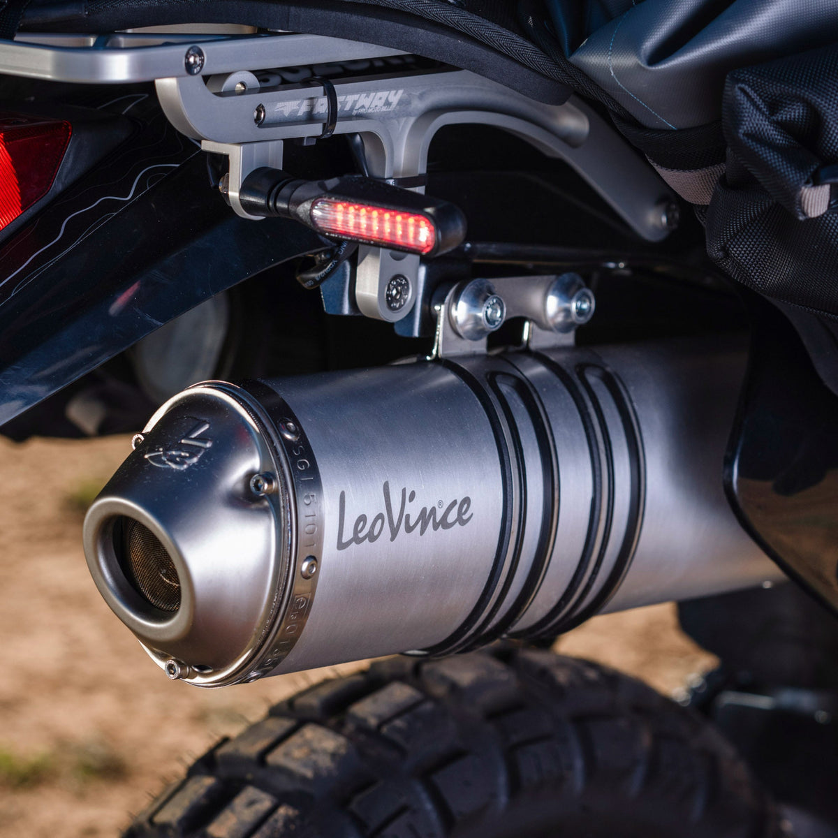 LeoVince 3378 LV-X aluminum slip-on exhaust muffler with carbon fiber mounting strap for the Suzuki DR650.