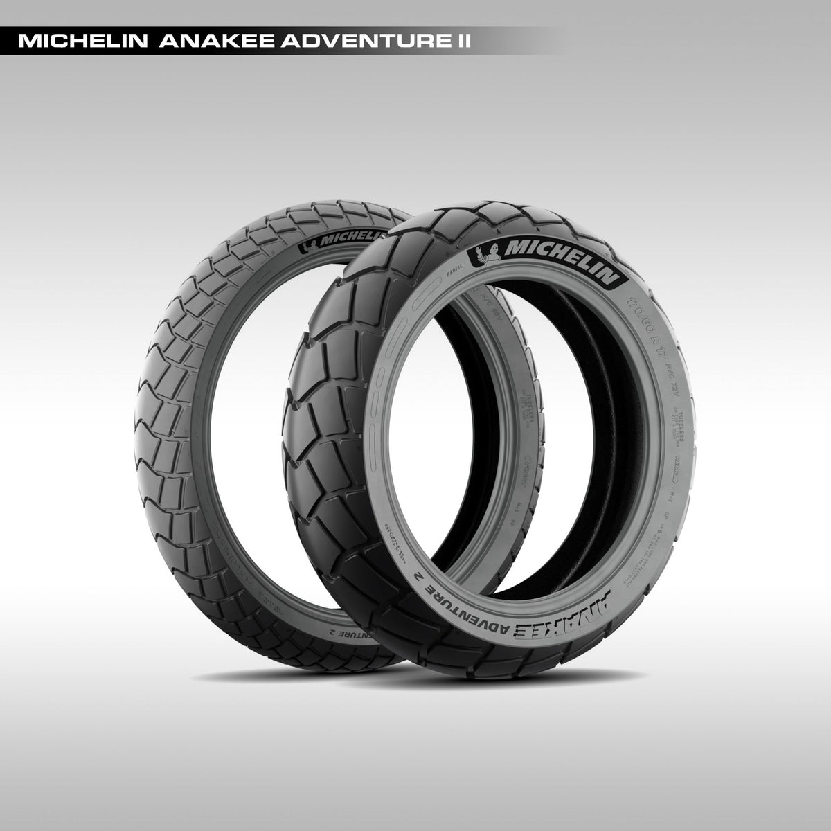Two Michelin Anakee Adventure II tires on a light gray background