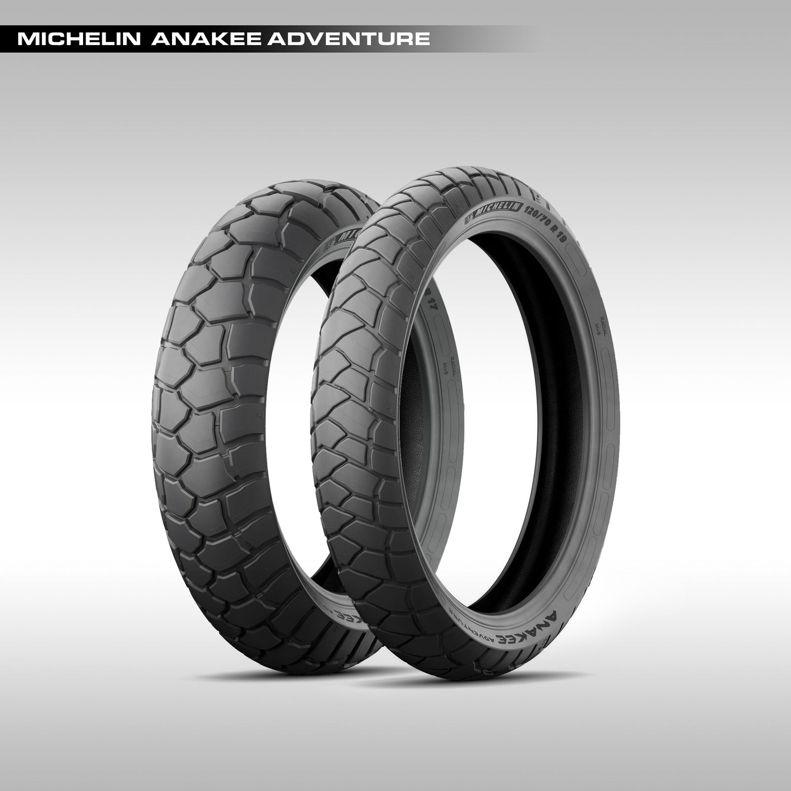 A pair of black Michelin Anakee Adventure motorcycle tires with tread patterns designed for on-road and wet grip capabilities and light off-road needs.