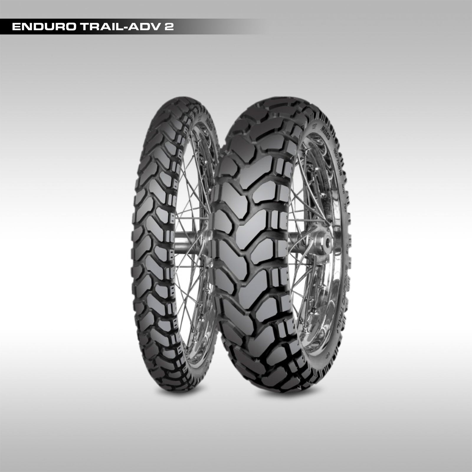 Two motorcycle tires with tread patterns on a gray background, labeled 'Enduro Trail-Adv 2'.