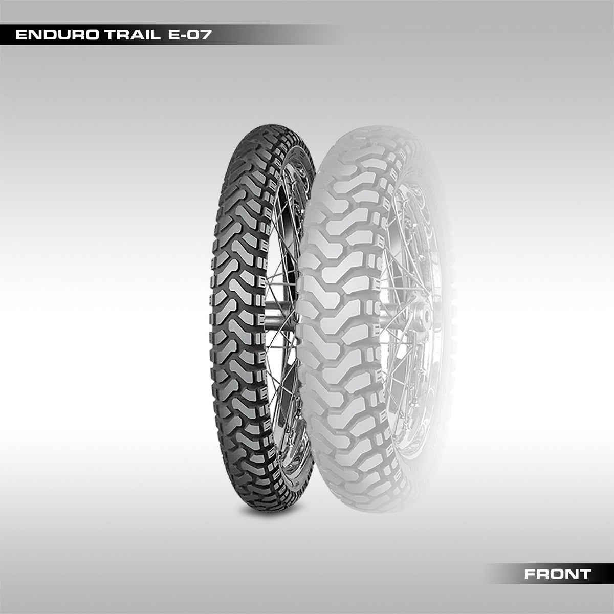 Front Mitas Enduro Trail E-07 motorcycle tires with block chevron pattern tread, one in foreground and one slightly behind.
