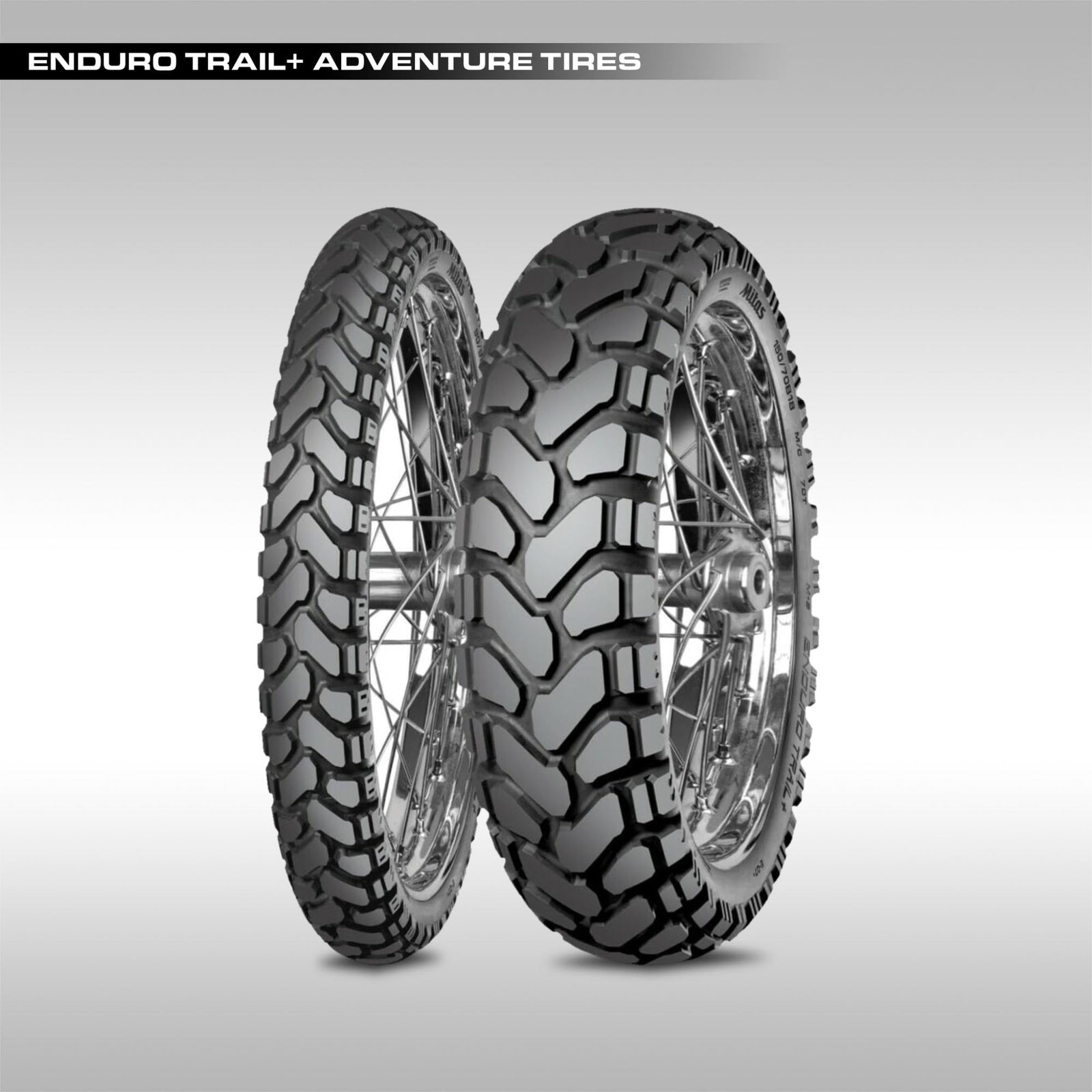 Mitas Enduro Trail+ adventure motorcycle tire showing the large chevron block tread pattern.