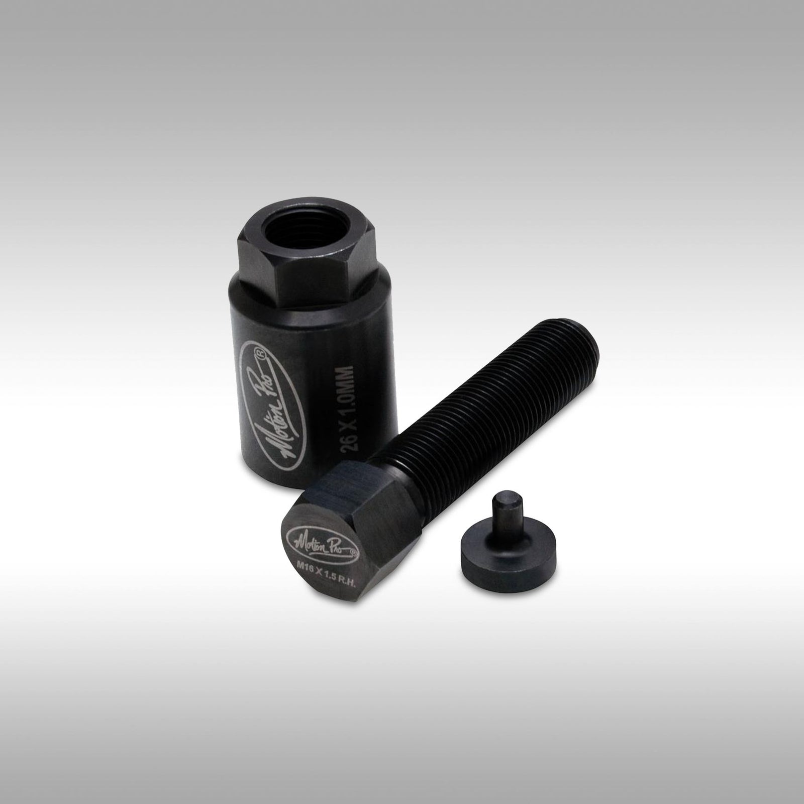 Black flywheel puller made by Motion Pro with hex nut protector on a gray background