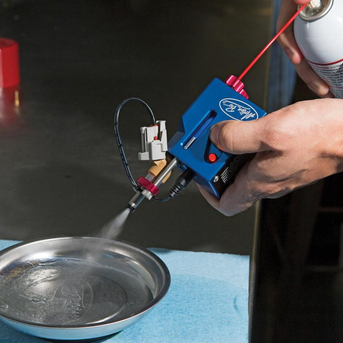 Motion Pro fuel injector cleaner in use in a shop environment