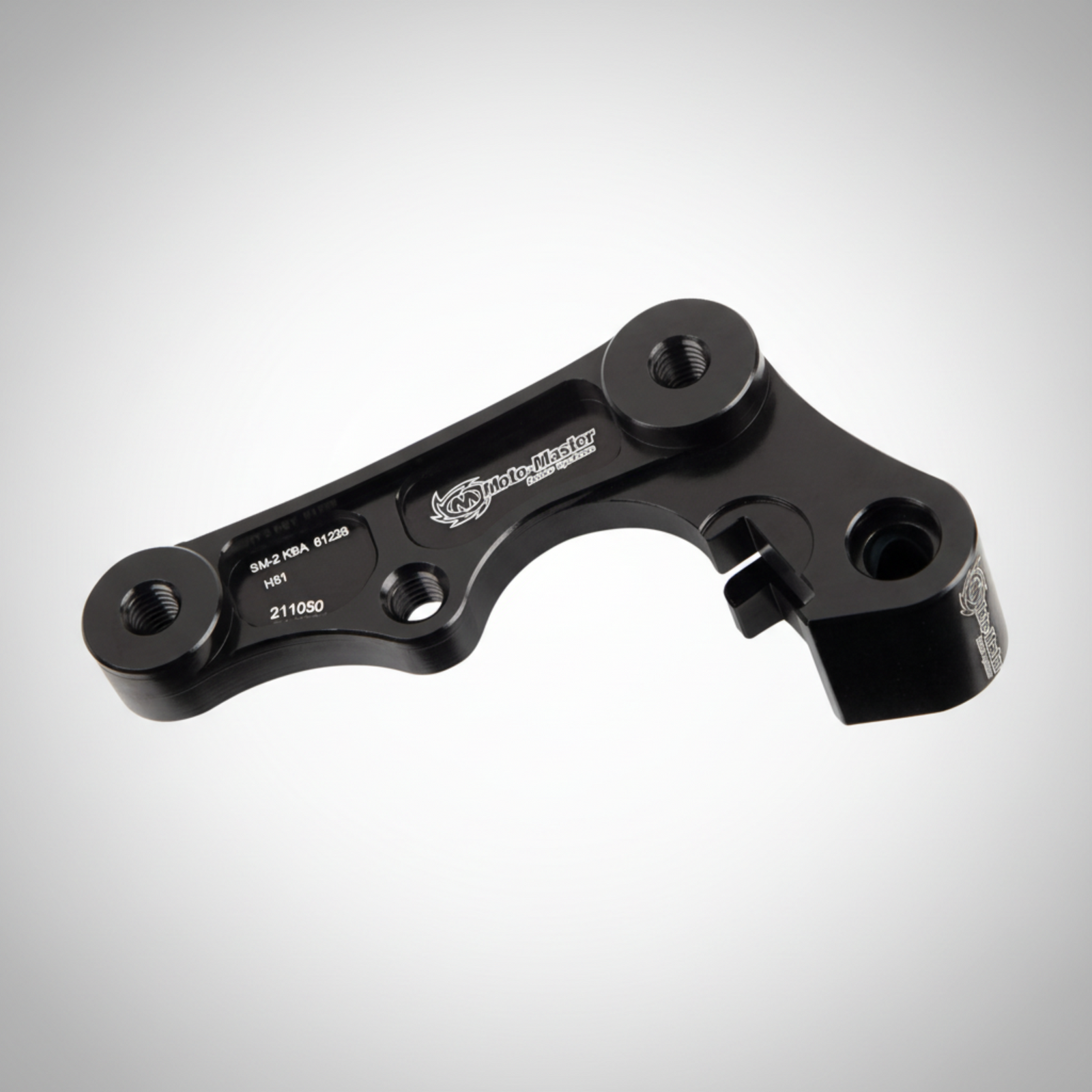 Black anodized aluminum caliper adapter from Moto-aster for Yamaha dirtbikes running an oversized rotor.