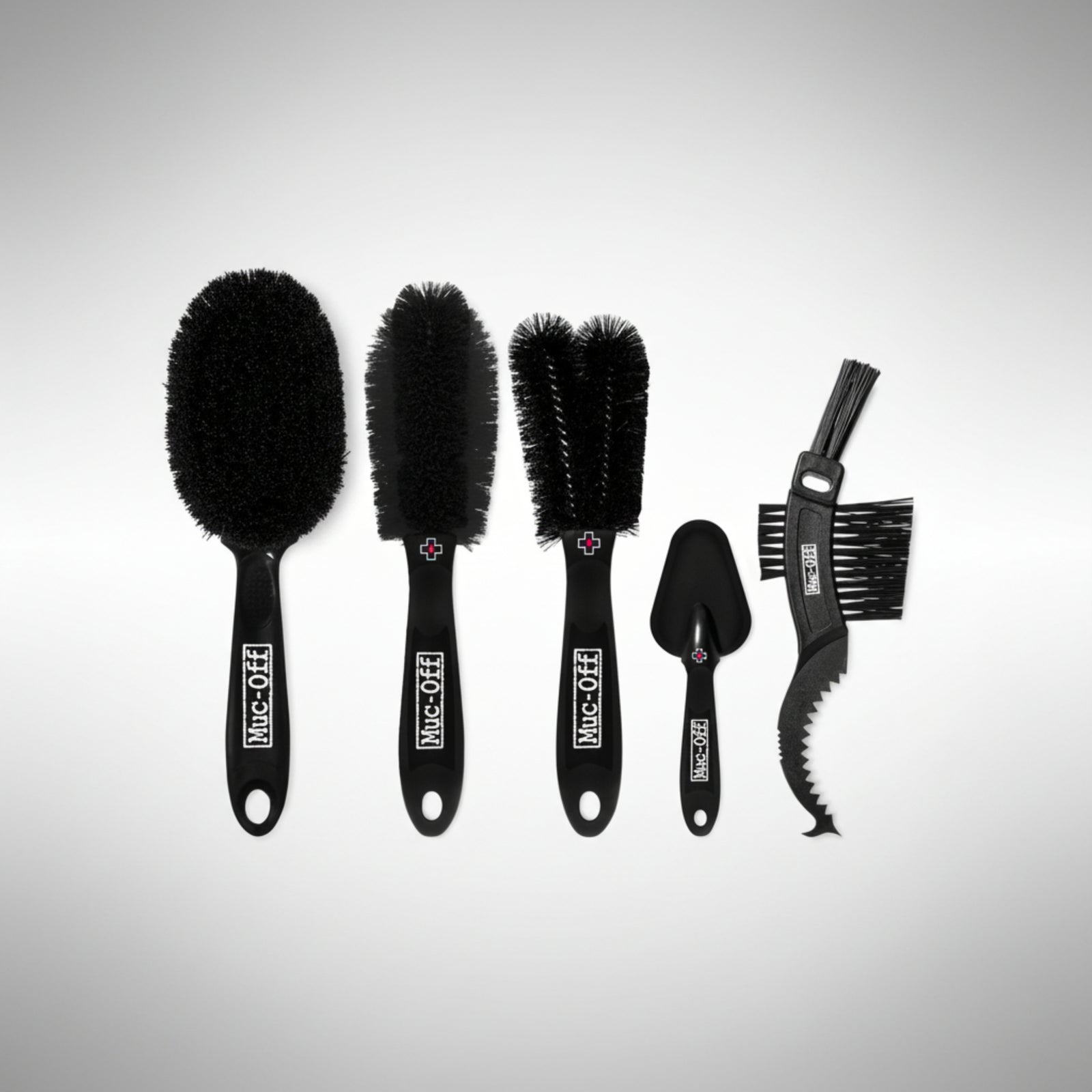 Muc-Off Premium 5-Brush Kit showing various detailing brushes for motorcycle cleaning.